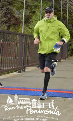 A picture of me crossing the finish line during a 10K race.