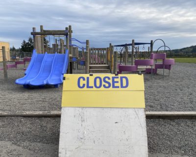 Closed sign on school playground.