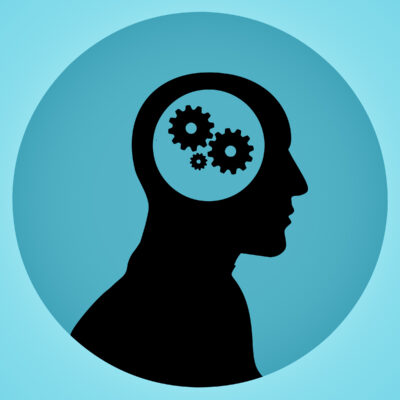 Human brain icon with gears in the head.
