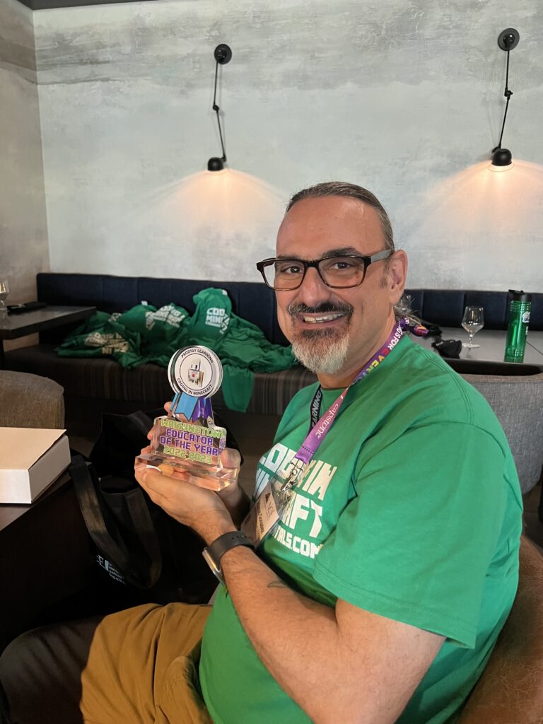 Photo of Al accepting Coding in Minecraft Teacher of the Year award for 2022-2023!