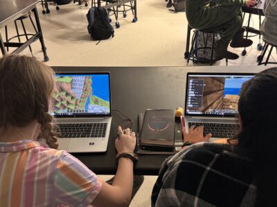 Students building together in a Minecraft multiplayer world.